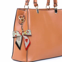 Blue Moon Studio™ Red Hearts & Bees Print Bow Bag Charm