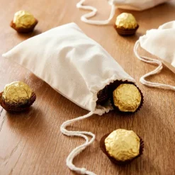 Cream Favor Muslin Bags by Celebrate It™, 12ct.