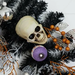 6ft. Artificial Halloween Black Garland with Skulls, Eyeballs & Spiders