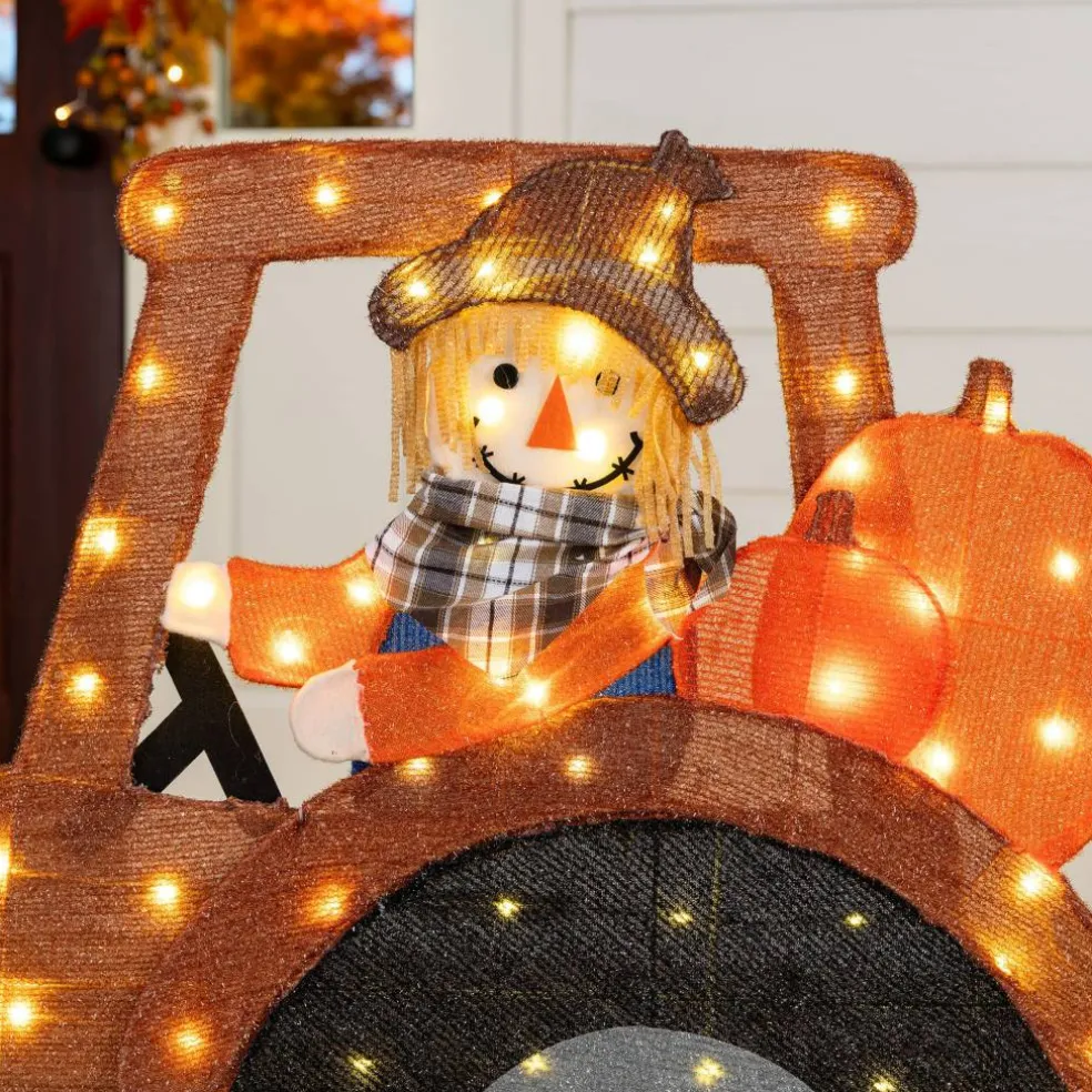 Glitzhome® 44" 2D Lighted Fall Scarecrow on Tractor Outdoor Decor with 100 Warm White LED Lights