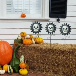 Glitzhome® 24" Halloween Metal Sunflower Skulls Glow-in-Dark Yard Stakes, 3ct.