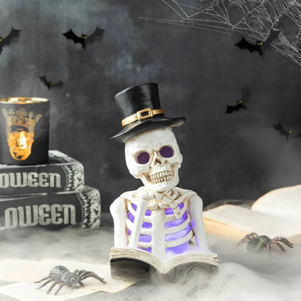 Glitzhome® 10" Lighted Halloween Resin Skull Reading Book Table Décor
