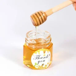 1.5 oz Hexagon Mini Glass Honey Jars with Wood Dippers,30 Pack Small Honey Jars with Gold Lids,Bee Pendants,Jutes,35 Bee Stickers,Perfect for Baby Shower,Wedding Favors,Party Favors