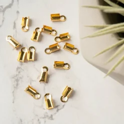 12 Packs: 15 ct. (180 total) 9mm 18K Gold-Plated Folding End Crimps by Bead Landing™