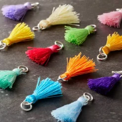 12 Packs: 12 ct. (144 total) Multicolored Tassel Rhodium Charms by Bead Landing™