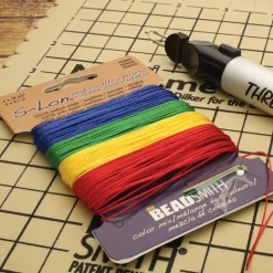 12 Packs: 4 ct. (48 total) The Beadsmith® S-Lon® 0.5mm Mixed Color Bead Cords
