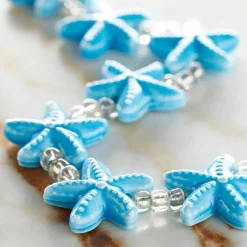 12 Packs: 9 ct. (108 total) Turquoise Starfish Ceramic Beads, 18mm by Bead Landing™