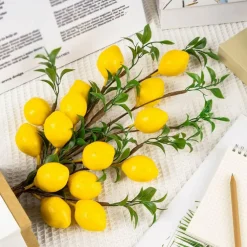 4pcs Artificial Lemon Branches, 19-inch vibrant yellow faux lemons with green leaves and bendable stems—perfect for home kitchen décor, garden displays, office desks, and summer party decorations.