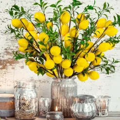 4pcs Artificial Lemon Branches, 19-inch vibrant yellow faux lemons with green leaves and bendable stems—perfect for home kitchen décor, garden displays, office desks, and summer party decorations.